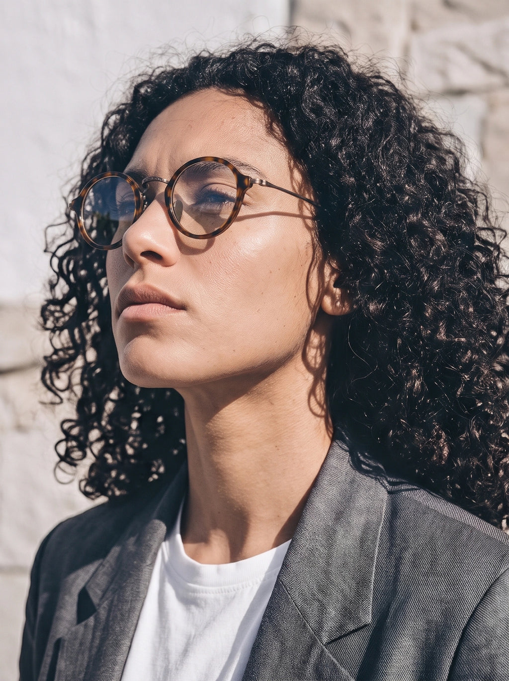 Woman wearing SUNSHADOR km1110 tortoiseshell round optical glasses