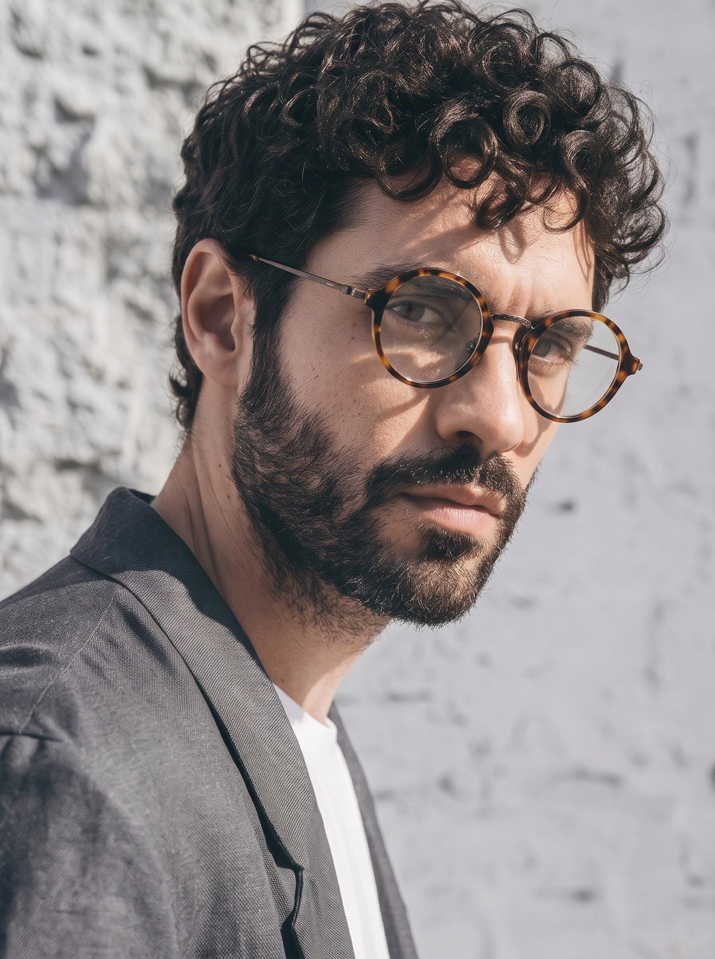 Man wearing SUNSHADOR km1110 tortoiseshell round optical glasses