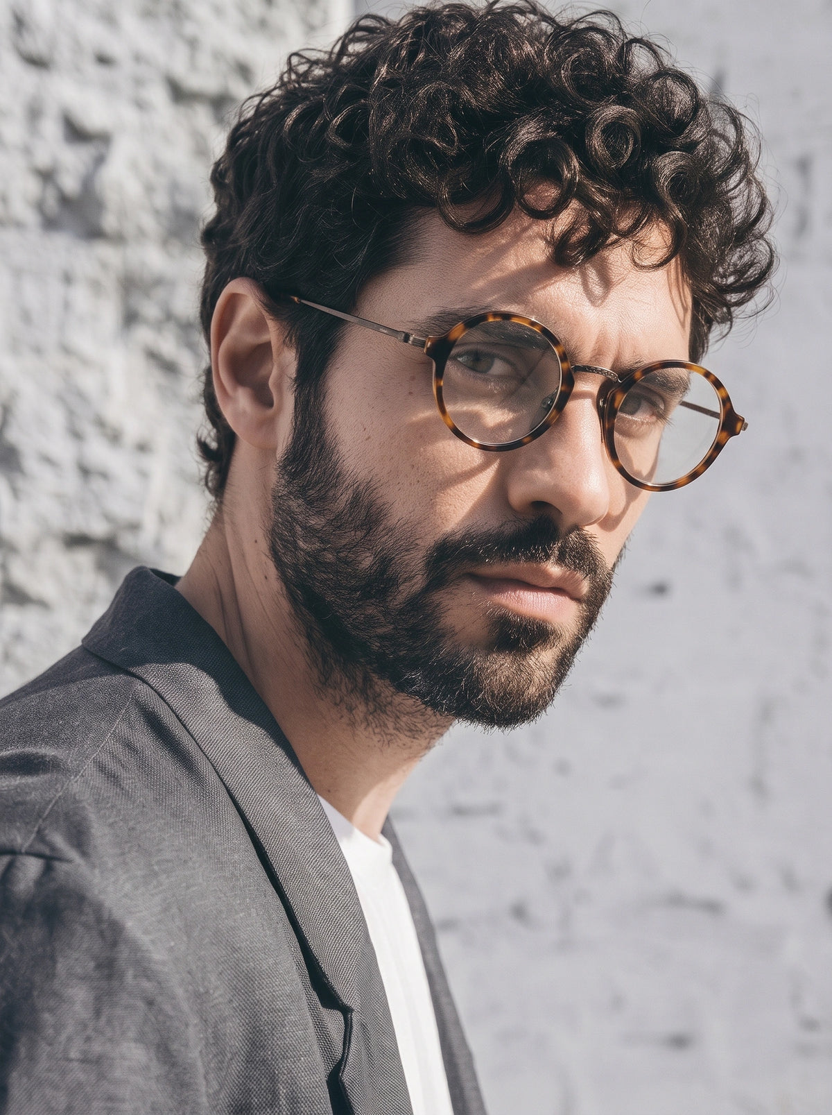 Man wearing SUNSHADOR km1110 tortoiseshell round optical glasses