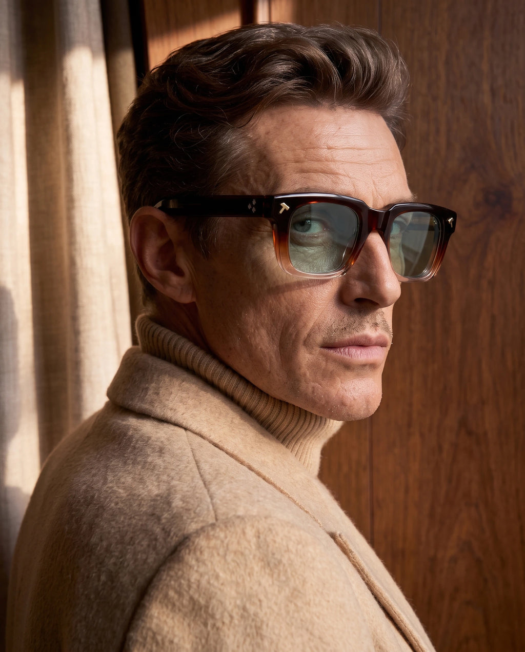quen gradient red acetate sunglasses with green lenses worn by a male model indoors