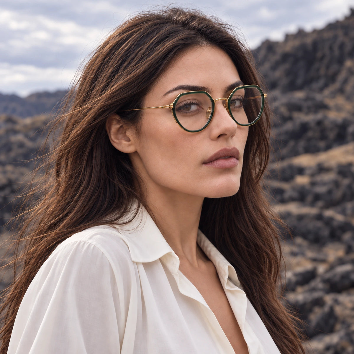 yt-01 green and gold geometric optical frame worn by a female model in a mountain landscape
